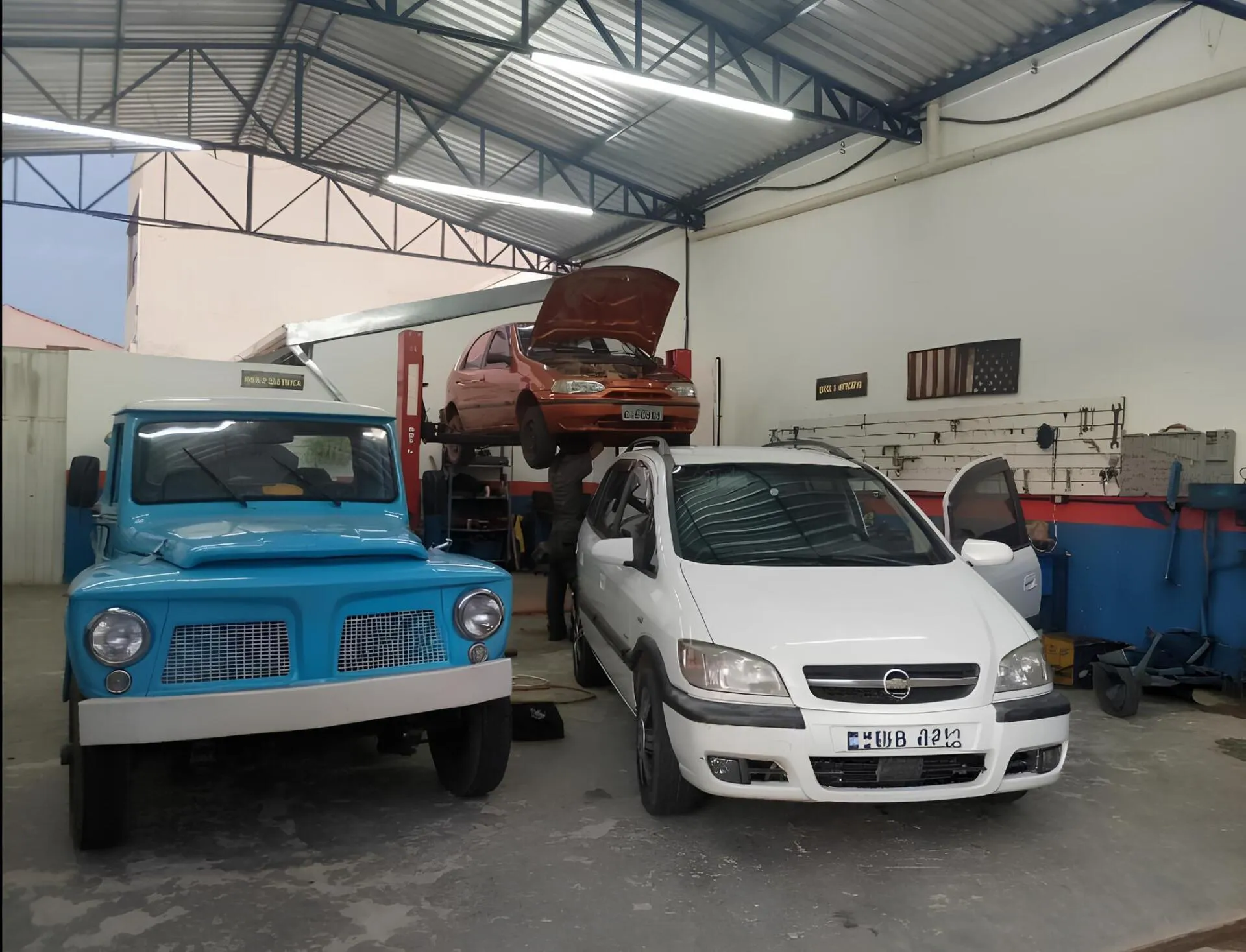 Carros sendo consertados